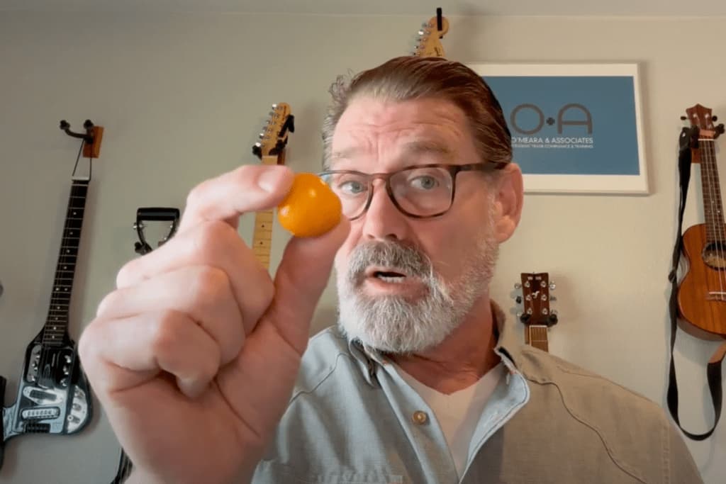 Arthur O'Meara holding a goldenberry