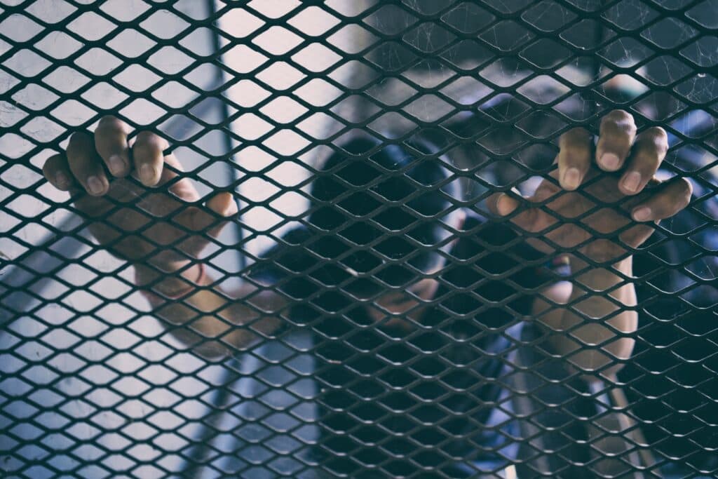 hopeless man in the cage, human trafficking