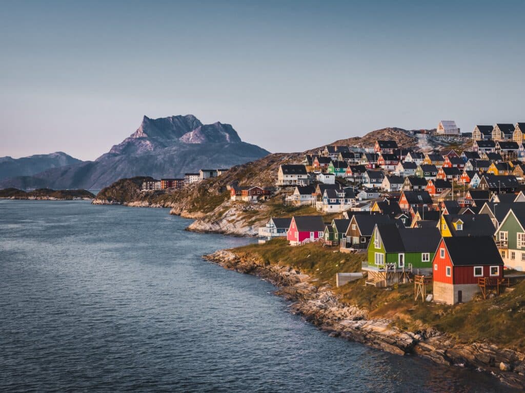 Photo of Nuuk, Greenland, with ocean and colorful homes