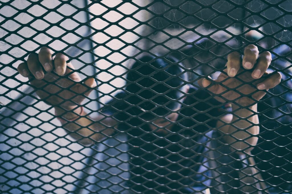 hopeless man in the cage, human trafficking